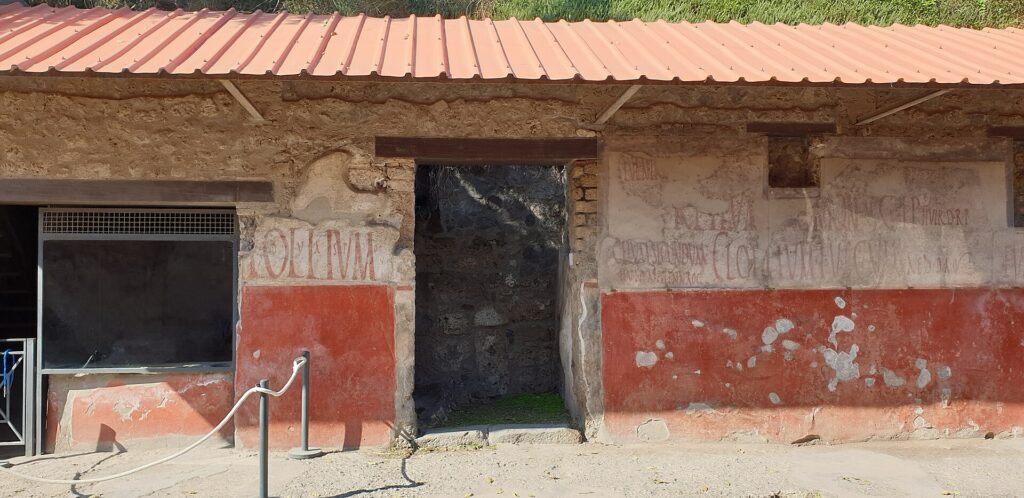 Regio IX.11.2. The front of the bar, with all the graffiti.